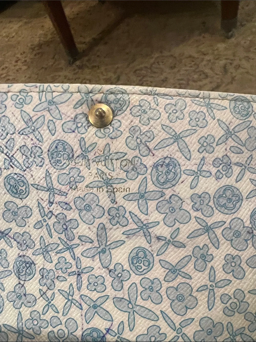 Louis Vuitton Monogram Sara wallet in Brown and Tan with blue floral interior